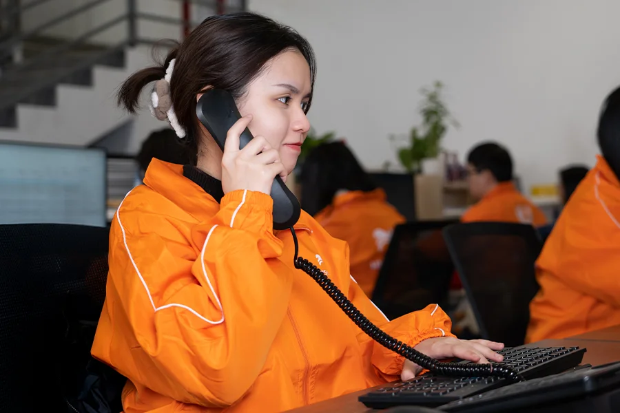 Hissen Vintage customer support taking a call from a client regarding their order.